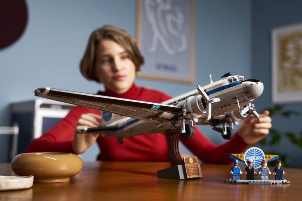 A woman looks at the LEGO Douglas DC-3 Pan Am Airliner set
