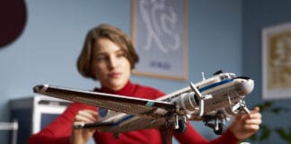 LEGO Douglas DC-3 Pan Am Airliner Takes You Back to the Golden Age of Aviation A woman looks at the LEGO Douglas DC-3 Pan Am Airliner set